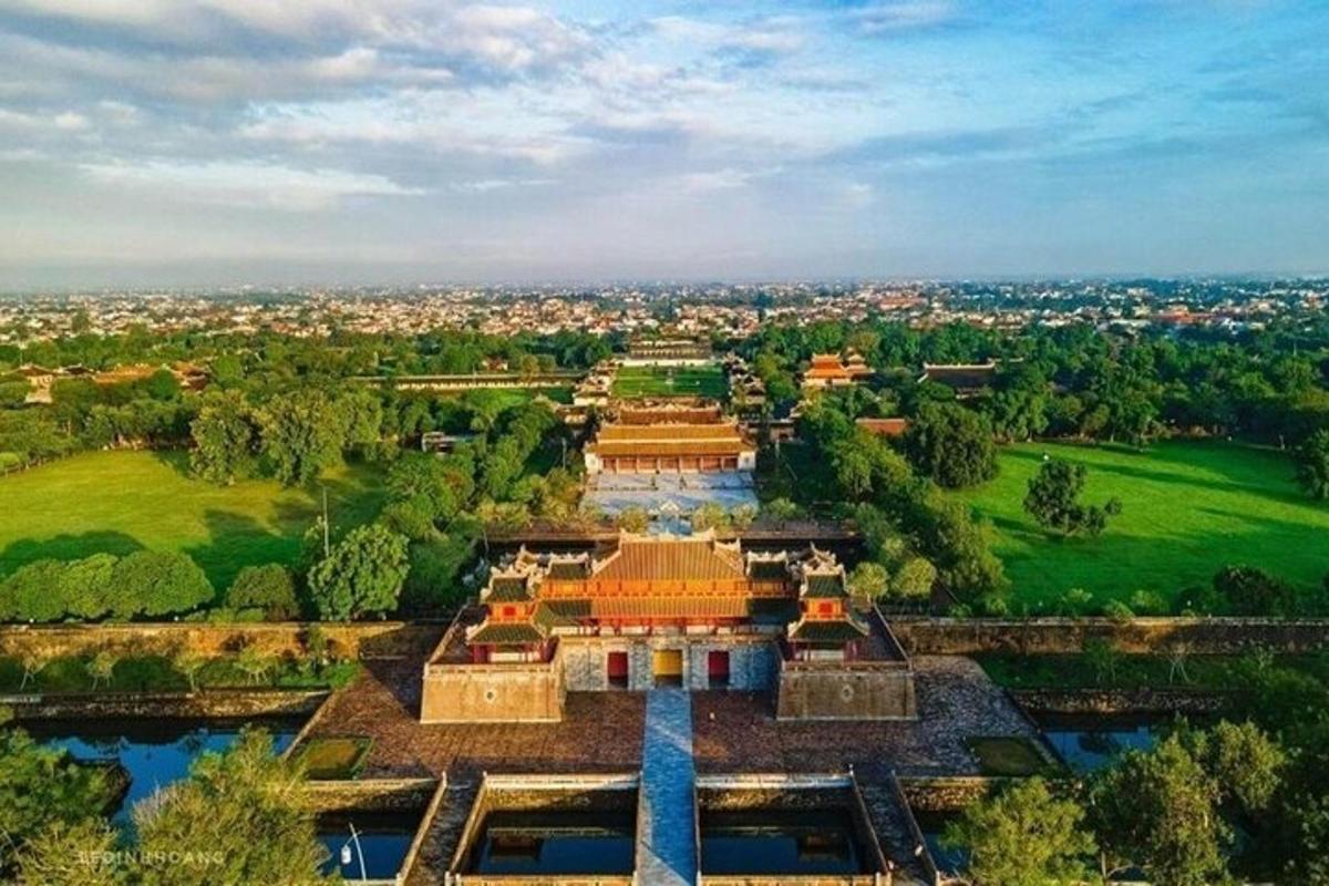 an aerial view of a large building with a city