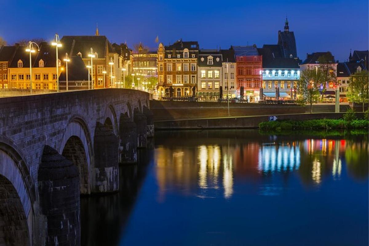 a bridge over a river in a city at night
