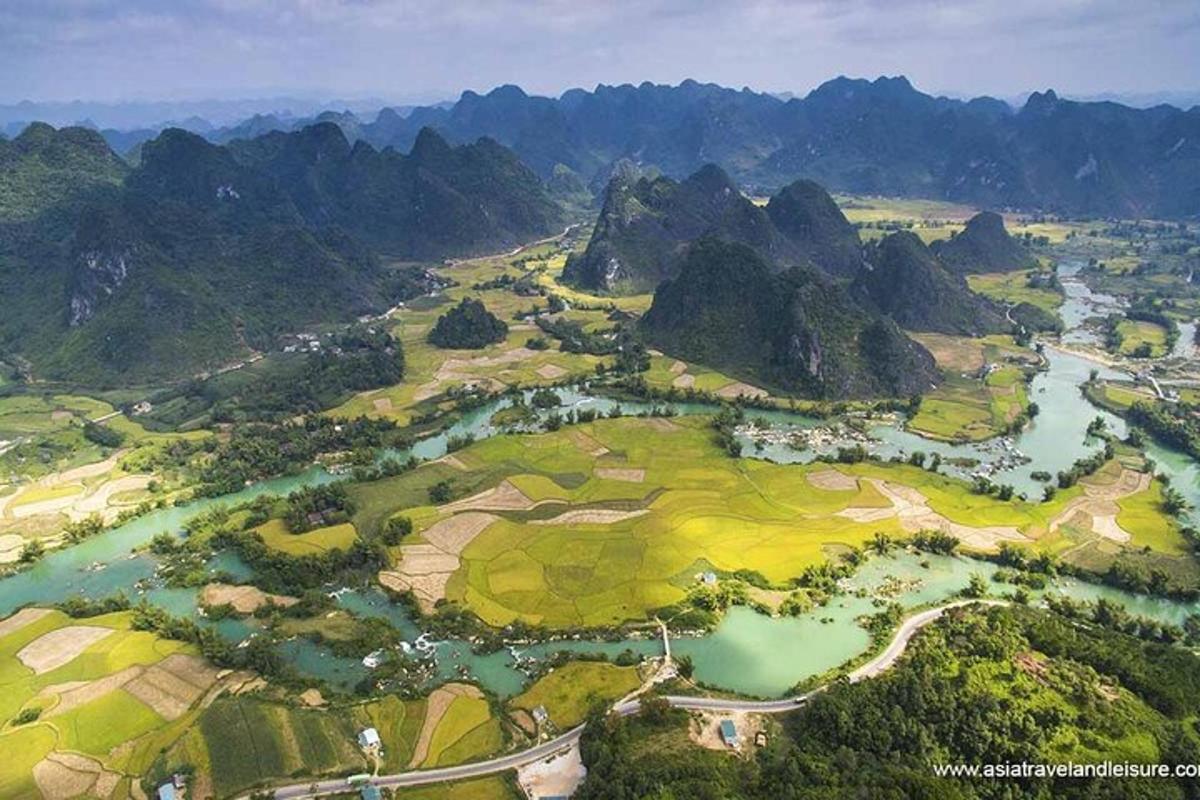 an aerial view of a golf course with a river