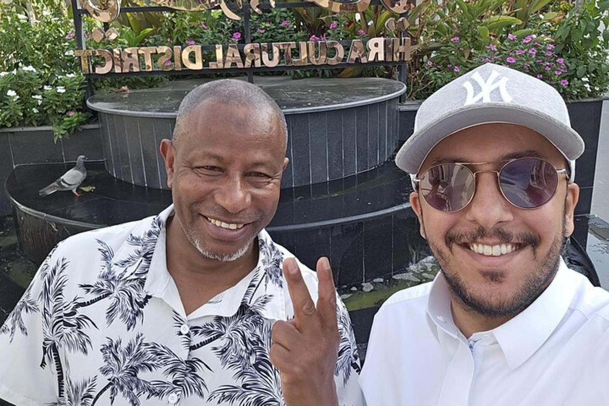 two men are posing for a picture together