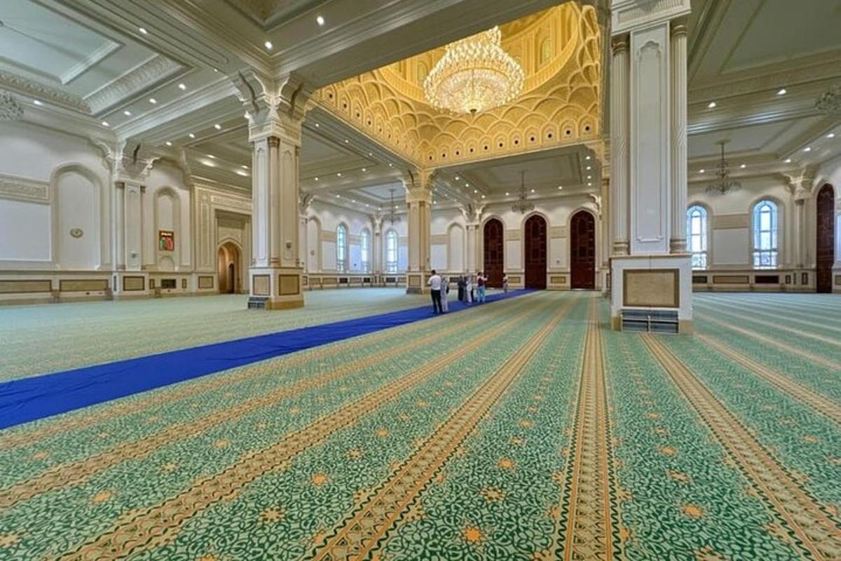 a man standing in a large room with a large ballroom