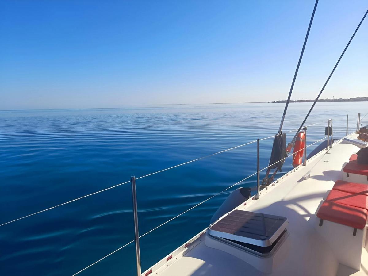 a boat floating in the water on the ocean