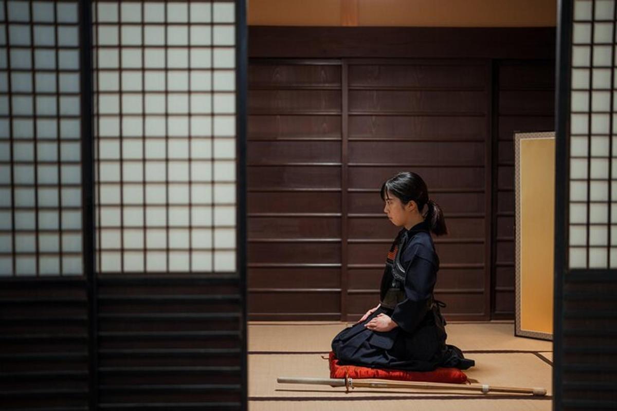 a woman sitting on a rug in a room