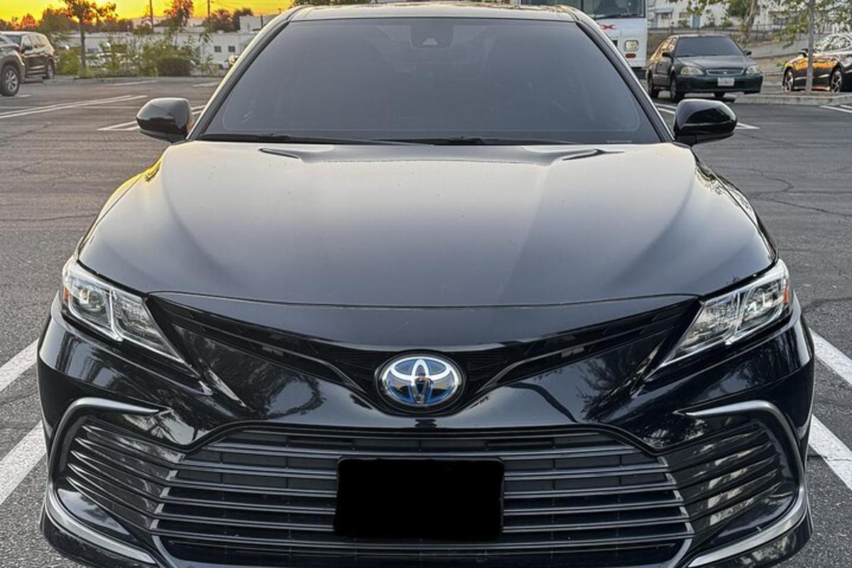 a black car parked in a parking lot