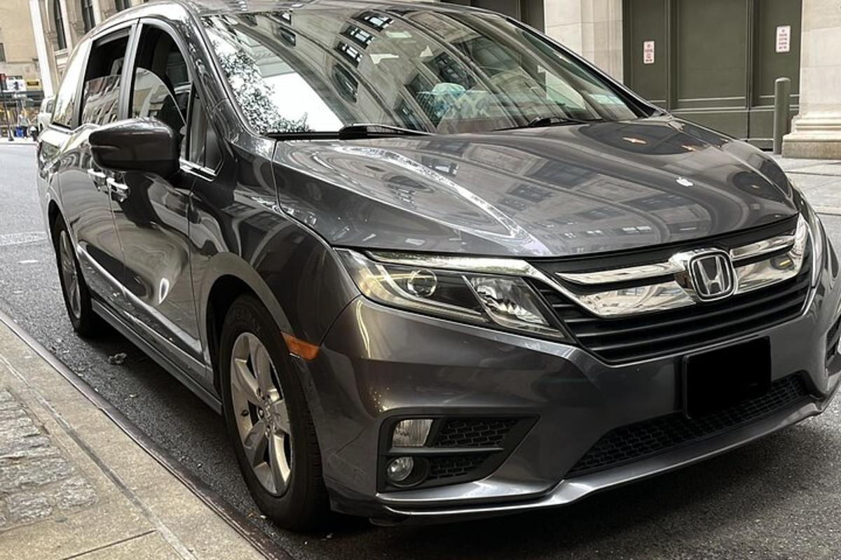 a black car parked on the side of a street
