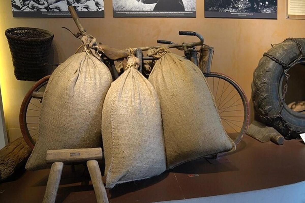 two bags on the back of a bike in a museum