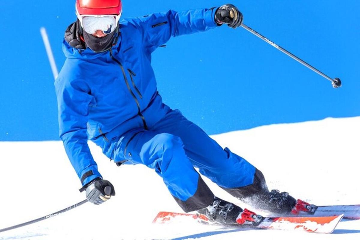 a person is skiing down a snow covered slope