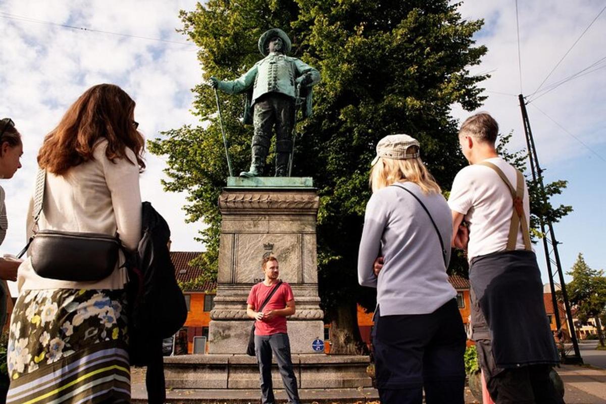 a group of people standing around a statue