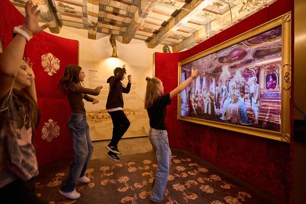 a group of people taking pictures of a painting on a wall