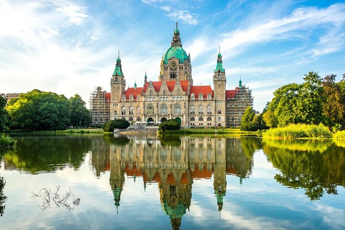a large building with a reflection in a lake