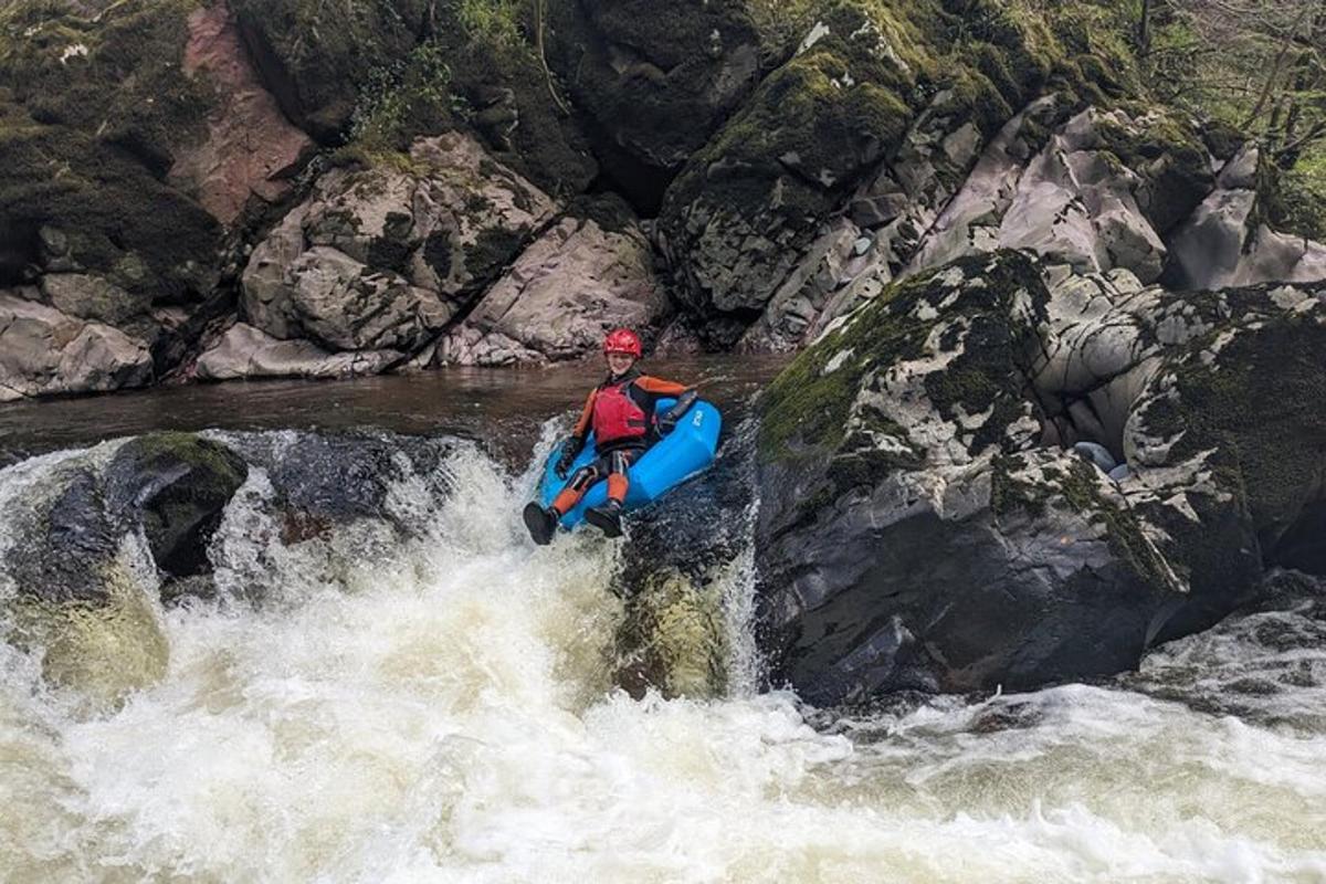 a man is in a raft in a river