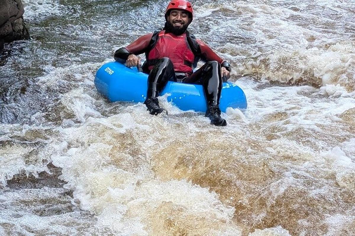a man in a raft in the water