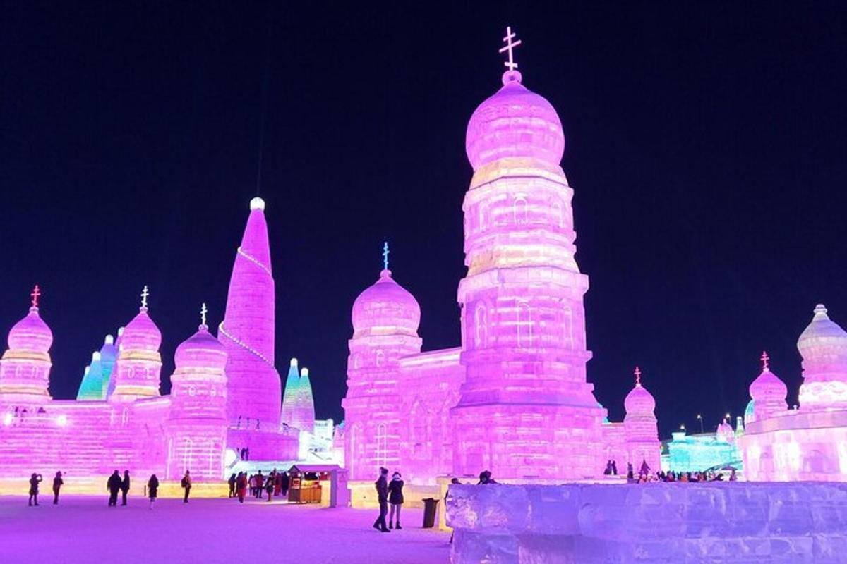a large ice castle is lit up at night