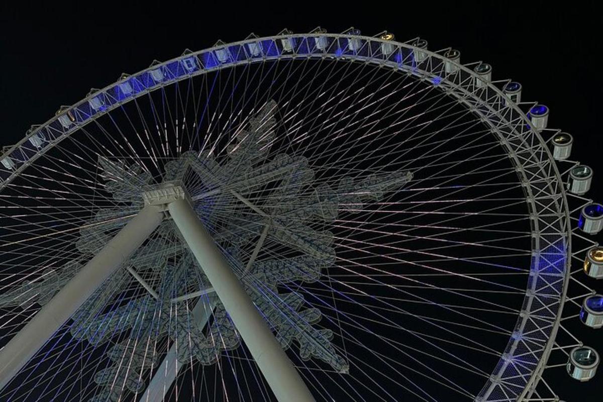 a large ferris wheel at night with