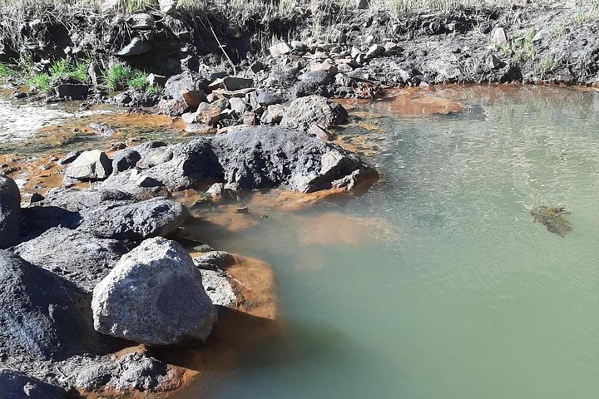 a group of rocks and water on a river