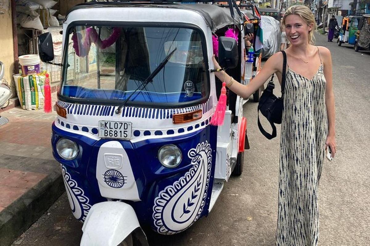 a woman is standing next to a small vehicle