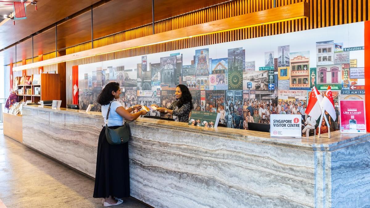 two women standing at a counter in a store