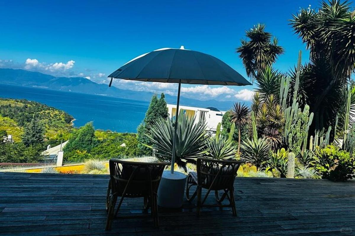 a table and chairs under an umbrella on a patio