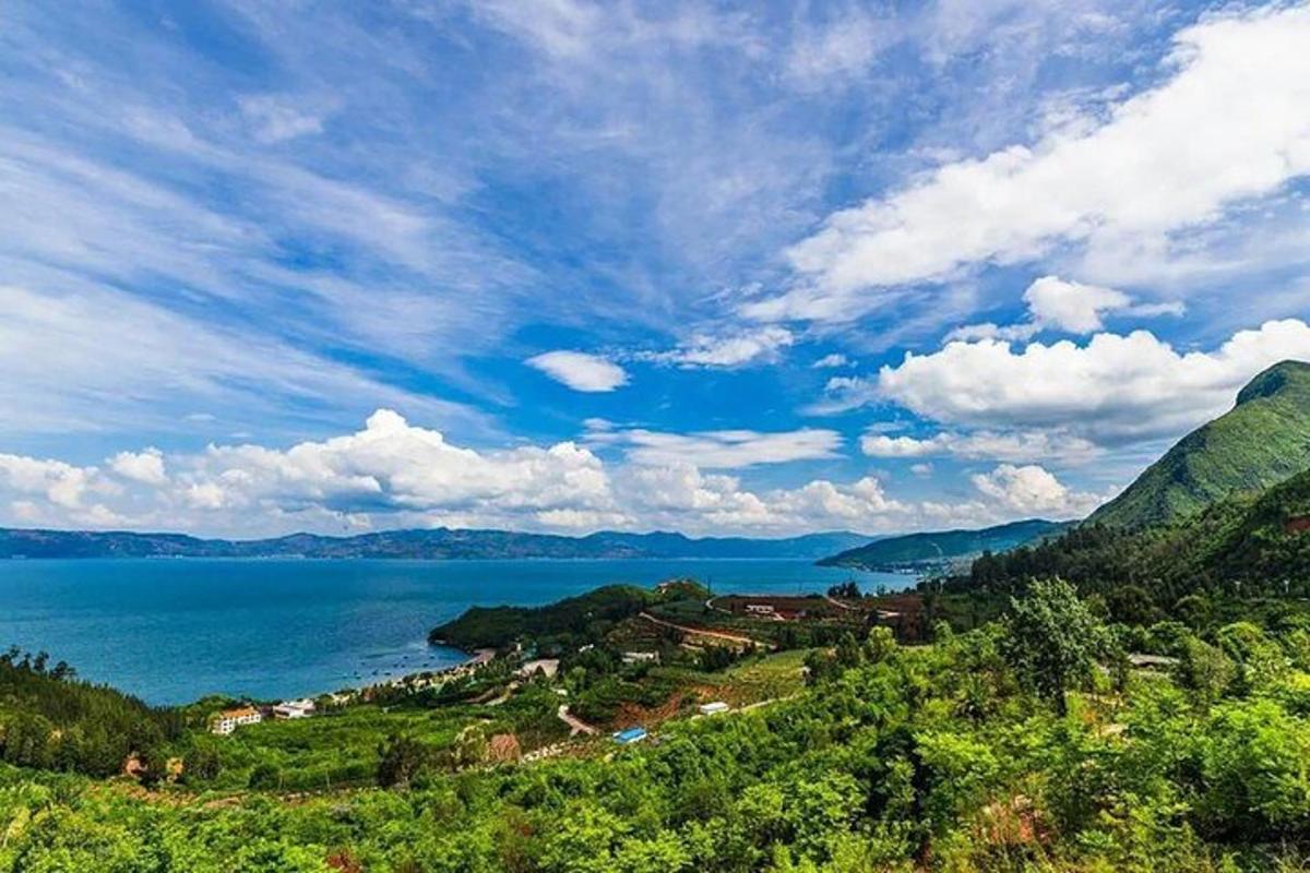 a view of a large body of water with a mountain