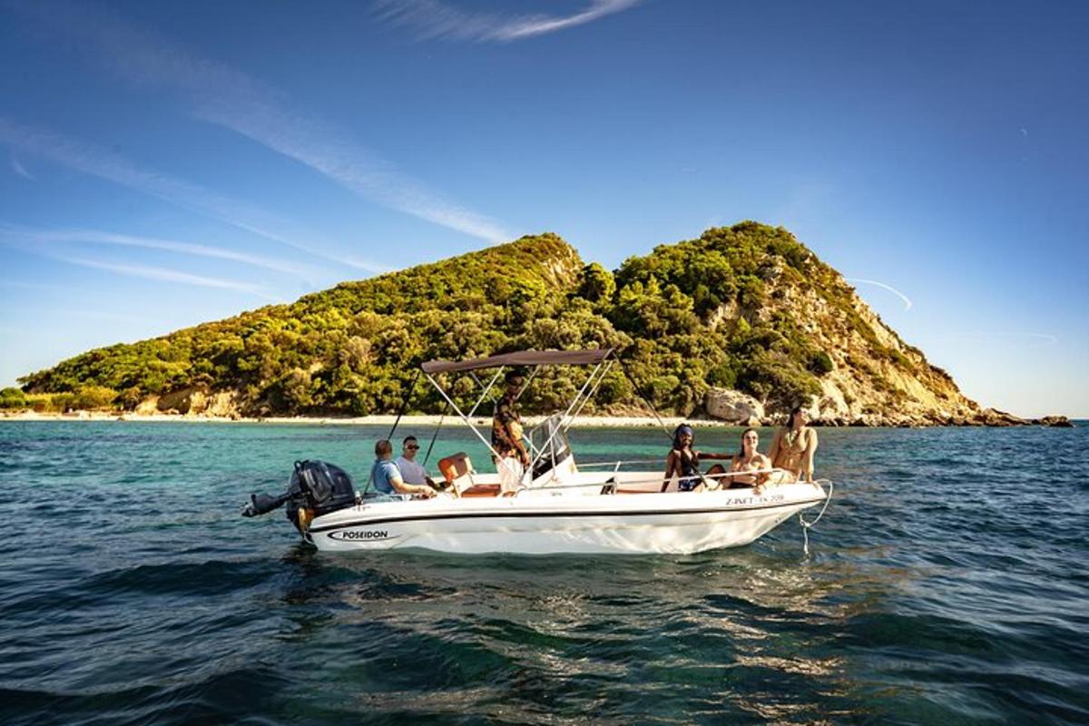 a group of people sitting on a boat in the water