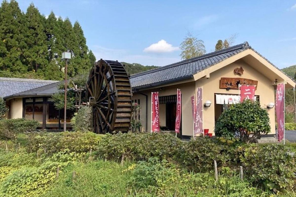 a building with a largemill in front of it