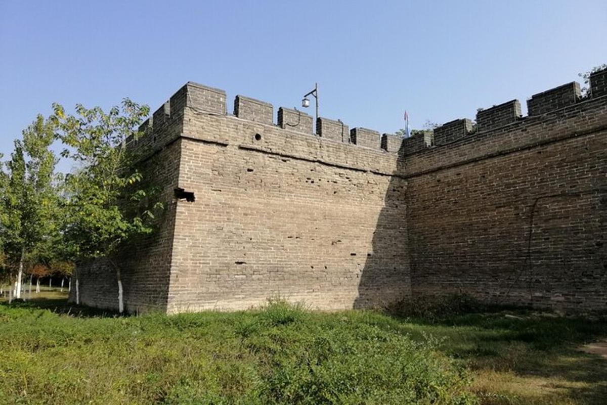 a large brickicked wall with a street light on top