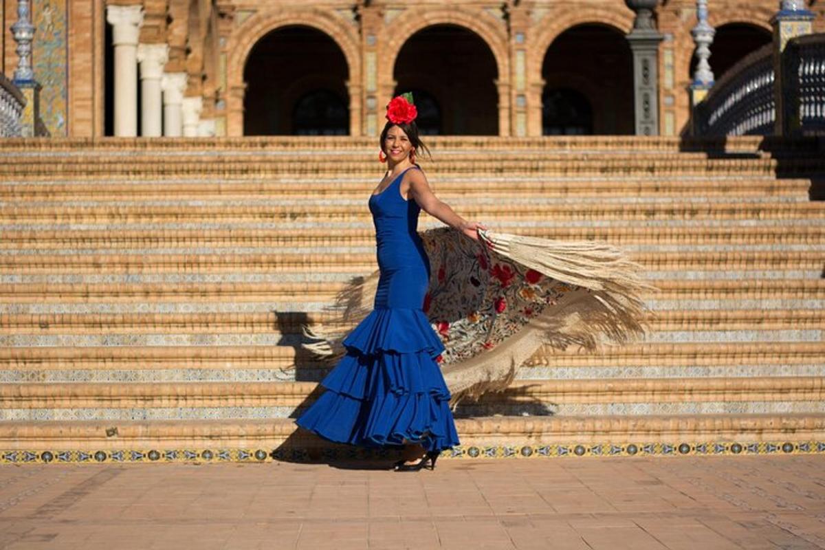a woman in a blue dress standing on some stairs