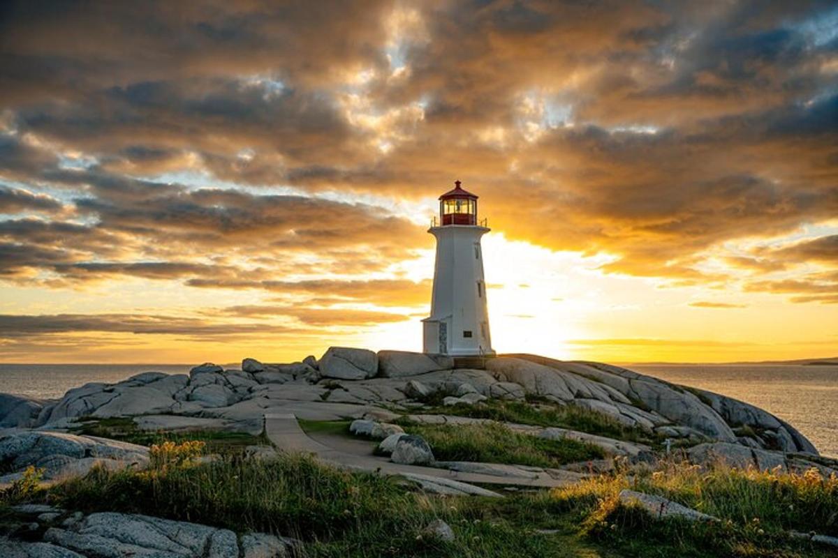 a lighthouse sitting on top of a rocky island