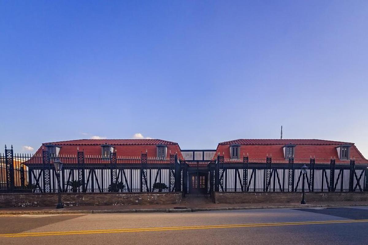 two red buildings on a bridge over a street