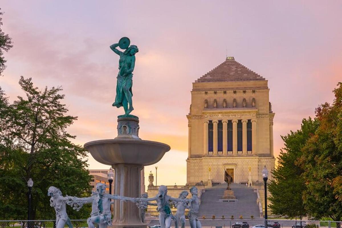a statue of a woman in front of a building