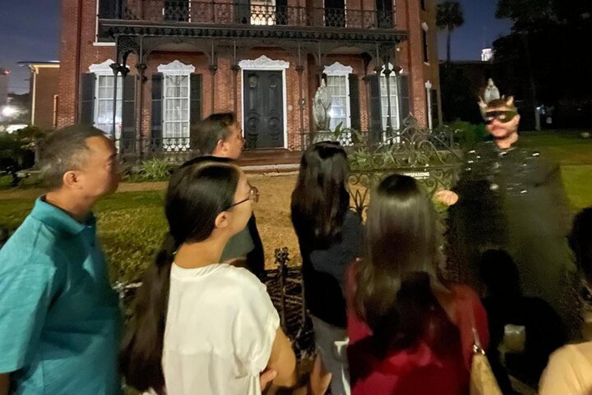 a group of people standing in front of a building