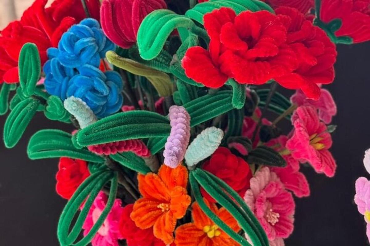 a bunch of colorful flowers in a vase