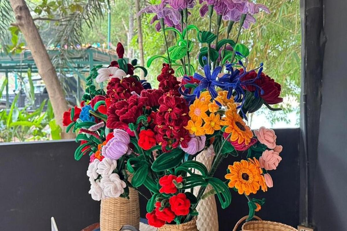 a bouquet of colorful flowers in baskets on a table
