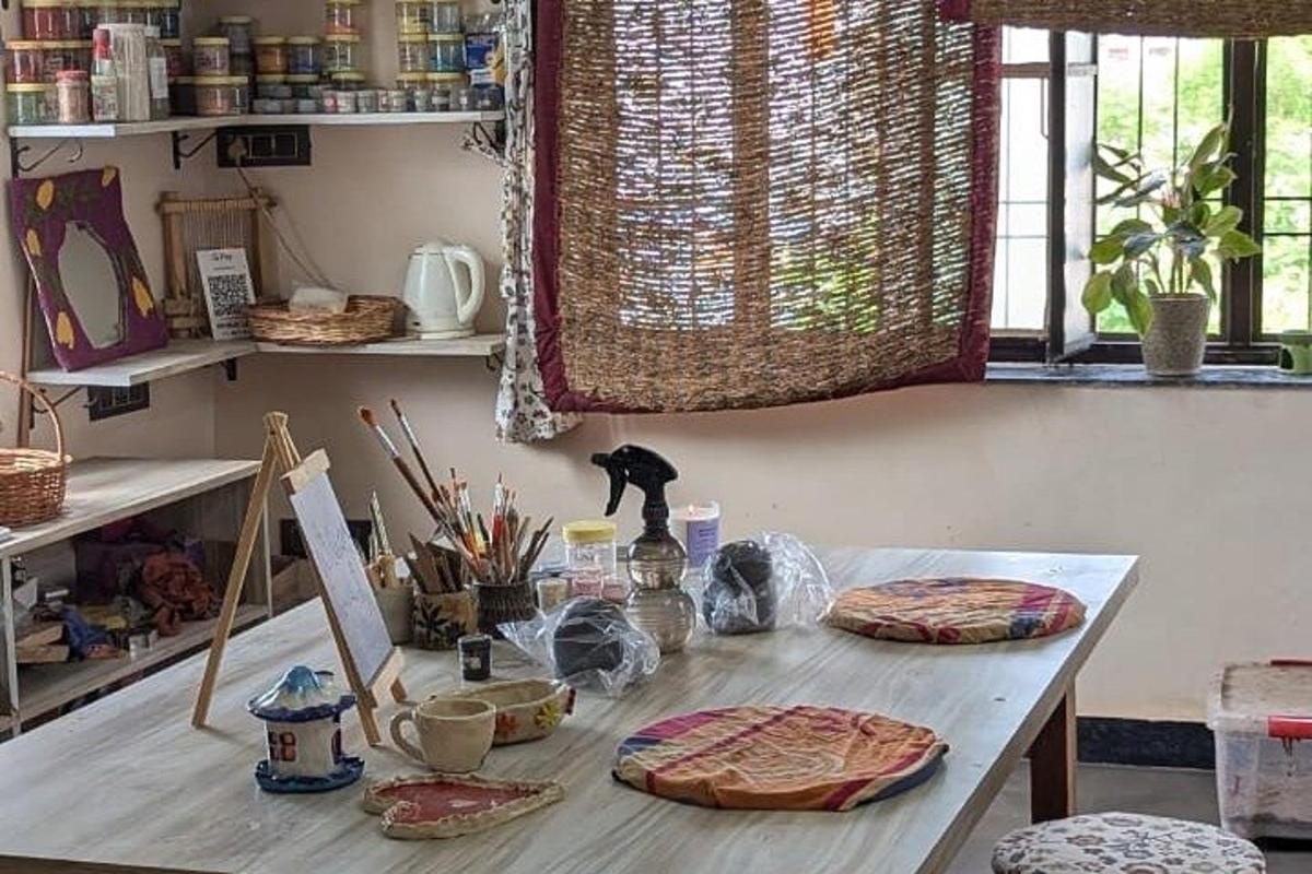 a table with art supplies on it in a room
