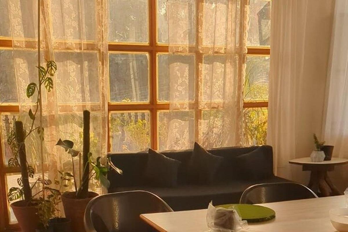 a living room with a couch in front of a window