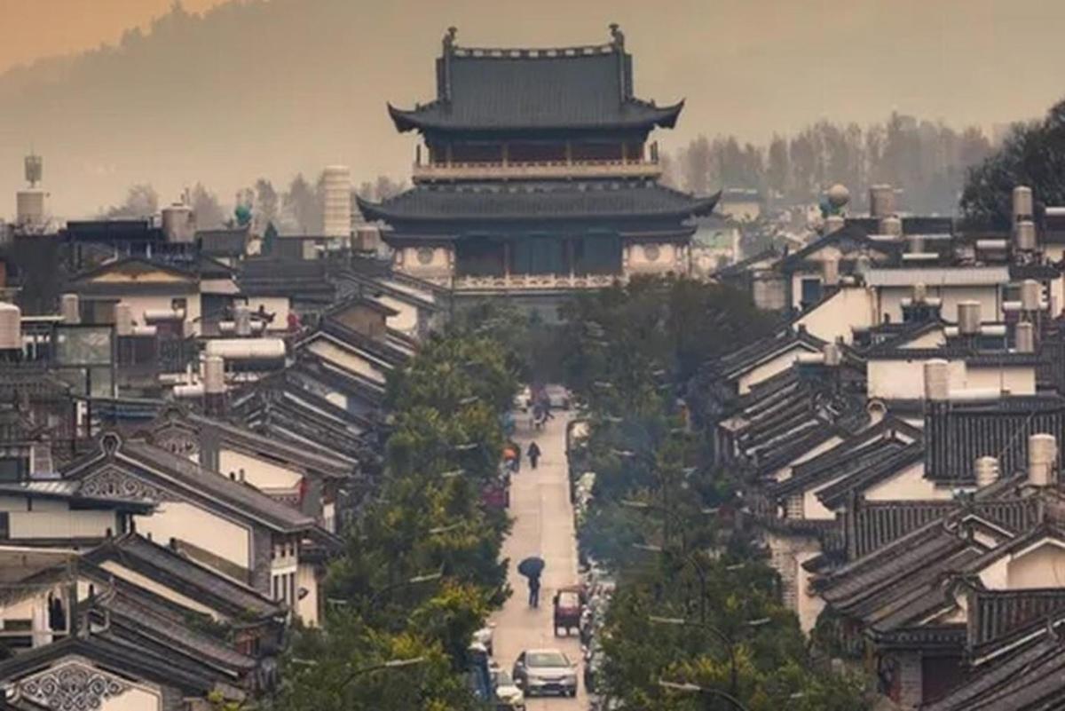 an asian city with a large building in the distance