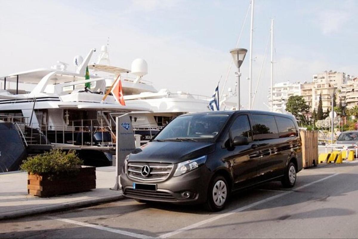 a van parked in a parking lot next to a boat