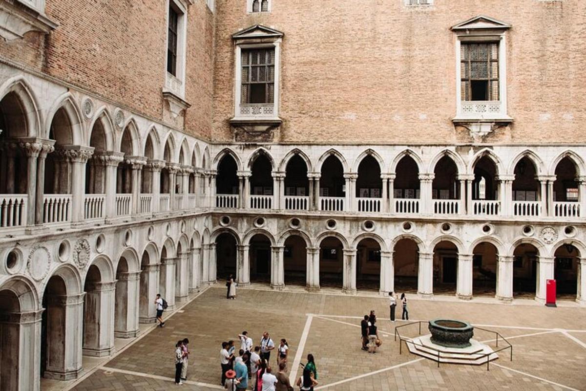 a group of people standing in the courtyard of a building