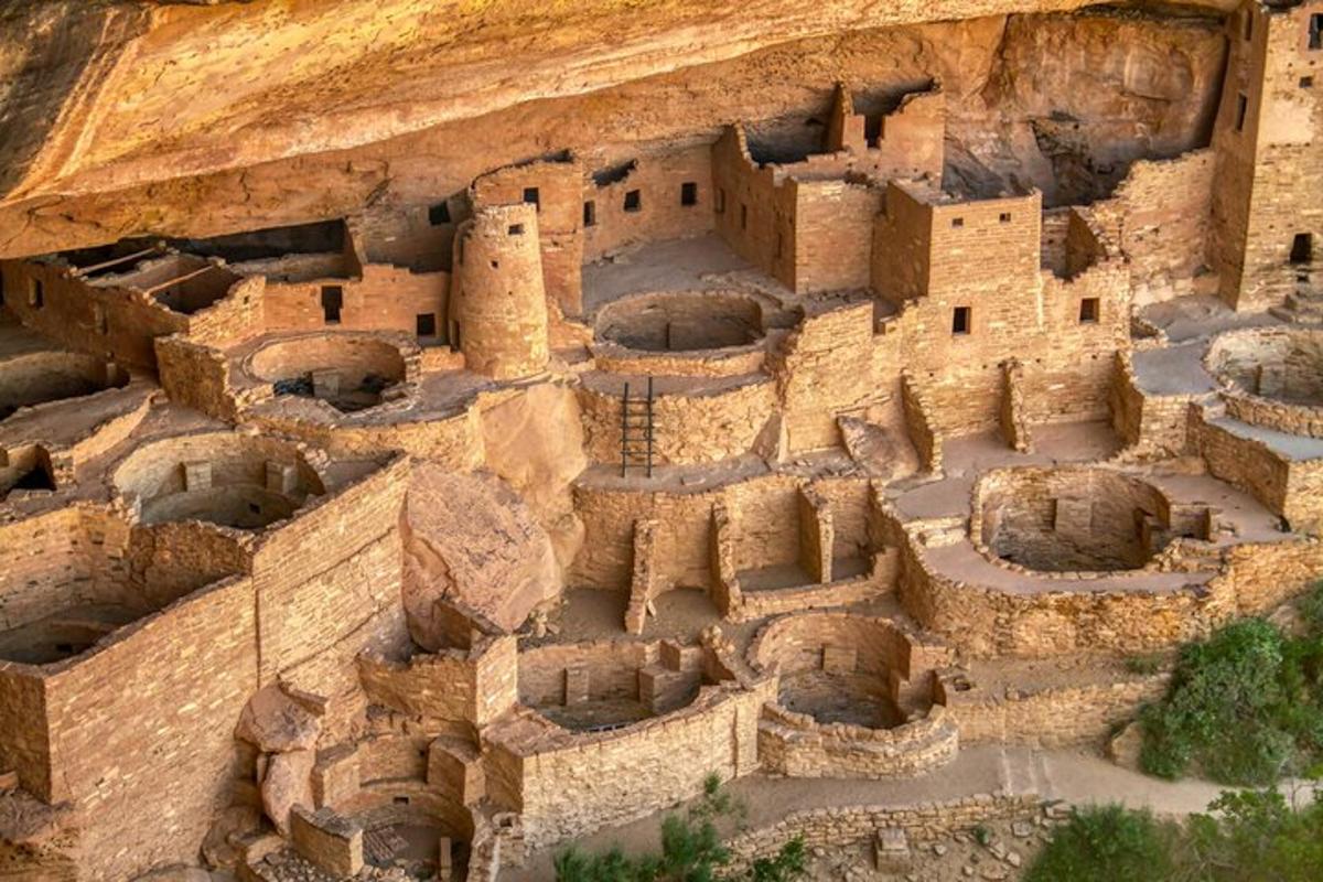 an aerial view of an ancient building on a cliff