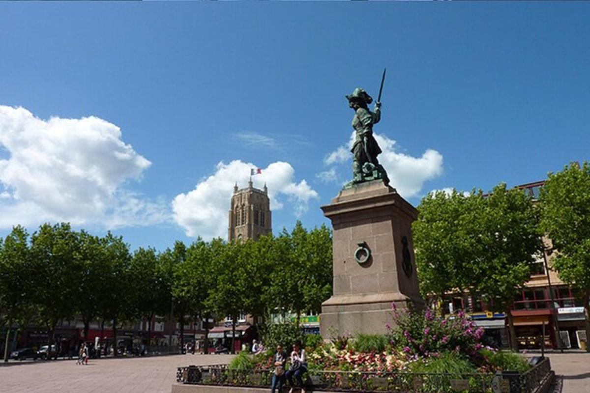 a statue of a woman on top of a monument