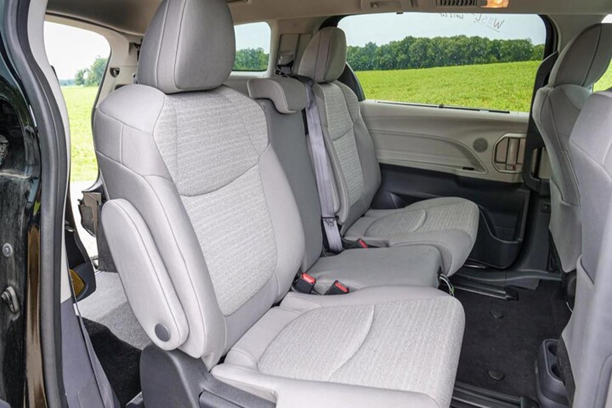 an empty back seat of a minivan with the back seats deployed