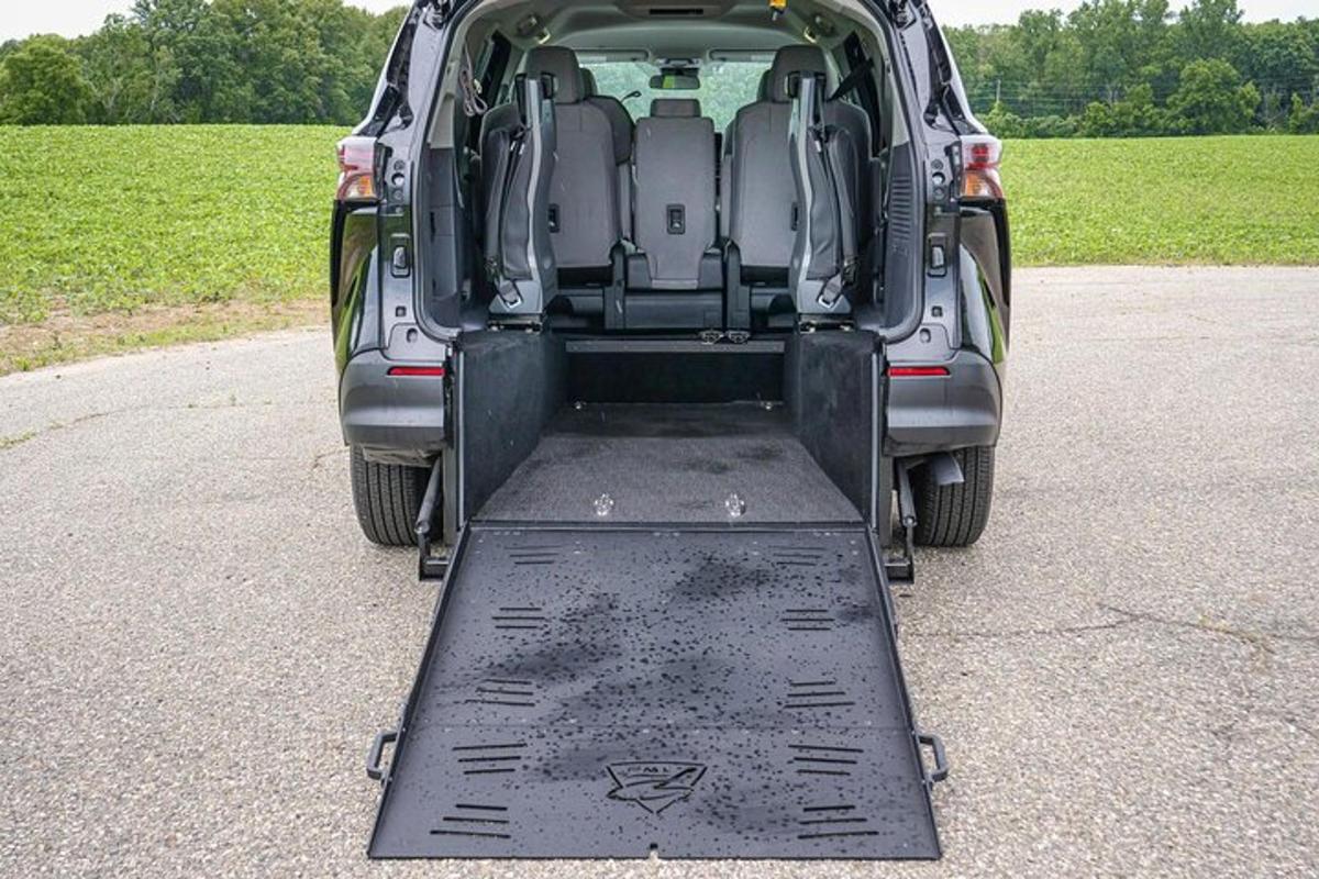 a open trunk of a car with its doors open