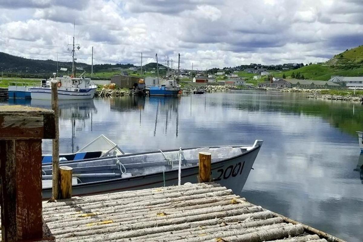 a boat is docked at a dock in the water