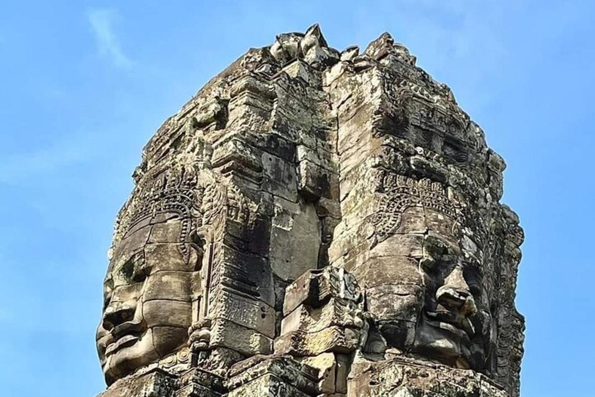a statue of a face on top of a building