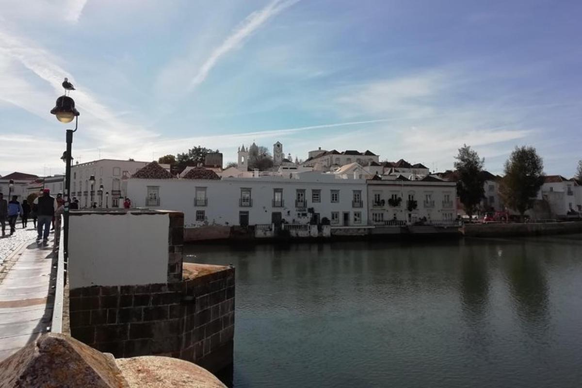 a building next to a body of water with buildings