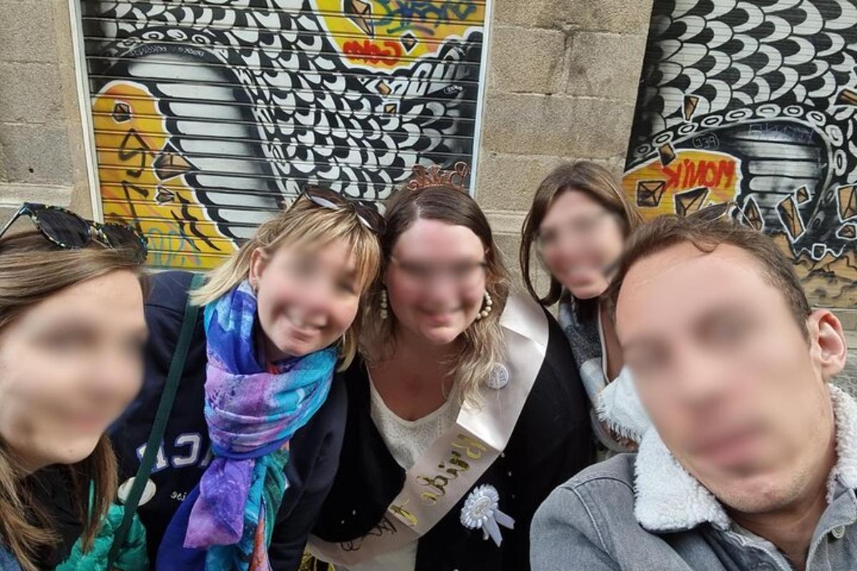 a group of people standing in front of a wall
