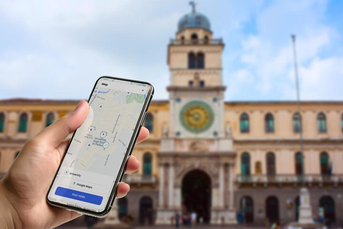 a person holding a cell phone in front of a building