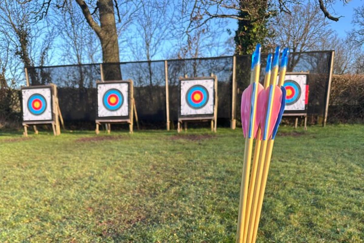 a group of targets in front of a fence
