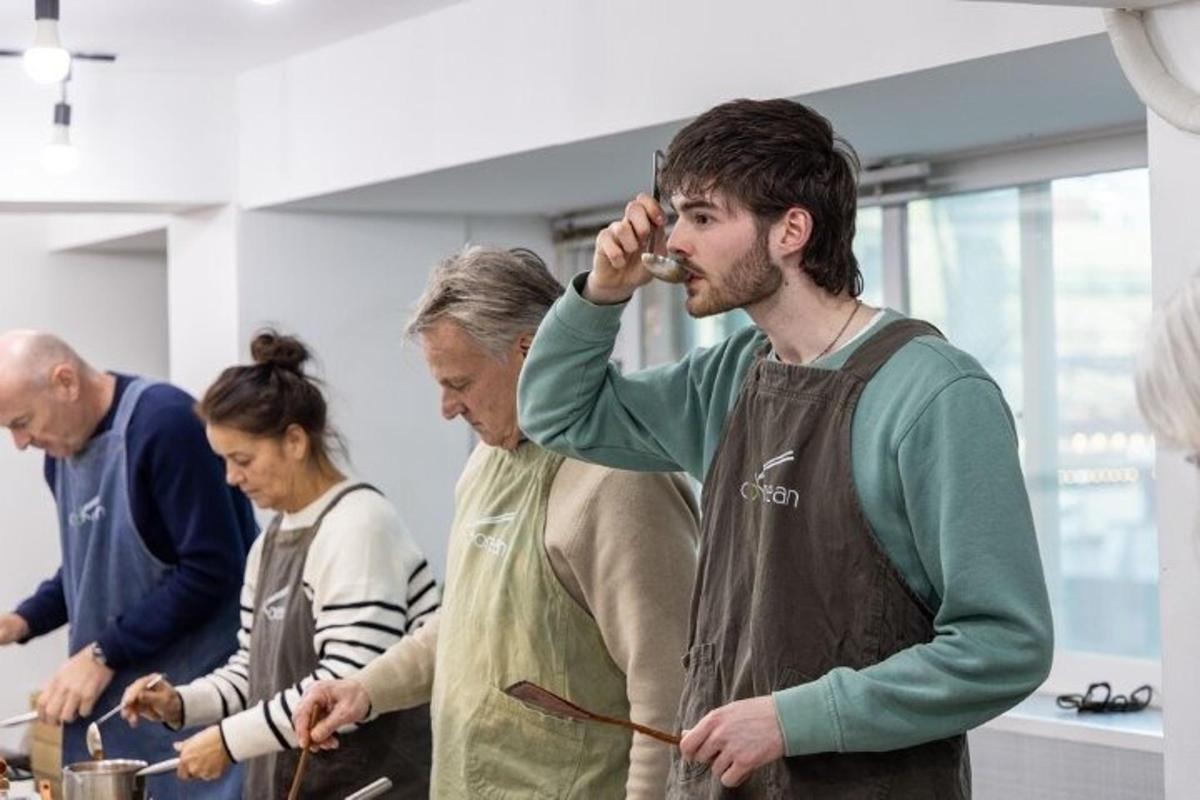 a group of people in a kitchen preparing food