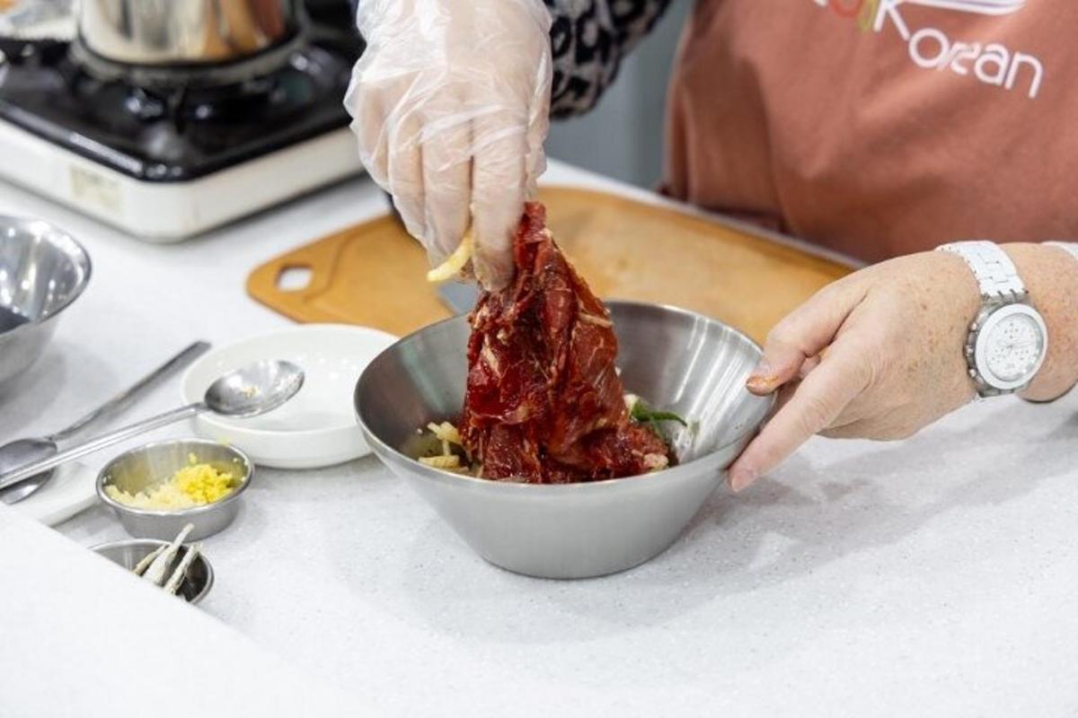 a person mixing food in a bowl on a counter